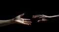 Two hands reach out to each other. Hands in motion towards on a black background Royalty Free Stock Photo