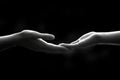 Two Hands Reaching, Support and Connection in Black and White Royalty Free Stock Photo