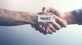 Two hands shaking with a sign that says trust Royalty Free Stock Photo