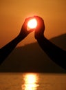 Two hands take a sun Royalty Free Stock Photo