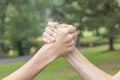 Two hands of teenagers are fighting among themselves in the park and the forest