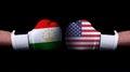 Two hands of wearing boxing gloves with USA and Tajikistan flag. Boxing competition concept. Confrontation between two countries