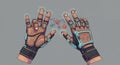 Two hands wearing high-tech gloves float against a gray background. The gloves Royalty Free Stock Photo