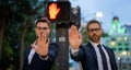 Two handsome business men in suit doing stop sing with hand. Warning expression with negative and serious gesture on the Royalty Free Stock Photo