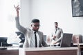 Two handsome cheerful african american businessman celebration successful with throwing paper in workplace Royalty Free Stock Photo