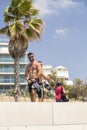 Two handsome Israeli men walking along the beach promanade of Te Royalty Free Stock Photo