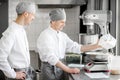 Confectioners working at the bakery manufacturing