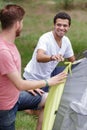 Two handsome men camping in woods Royalty Free Stock Photo