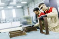 Two handsome young men working in furniture factory Royalty Free Stock Photo