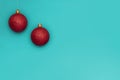 Two Red Christmas Balls Hanged Against Greenish Background. Copy Space on The Right Side Royalty Free Stock Photo