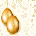 Two hanging golden Easter eggs Royalty Free Stock Photo