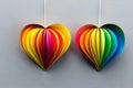 Two hanging rainbow colored paper cut out in the love heart shape. Paper art rainbow heart background with 3d effect, heart shape Royalty Free Stock Photo