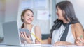 Two happiness Business Women Meeting and talking with notebook and paper files work in around table In modern office. Business Royalty Free Stock Photo