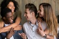 Two happy african and caucasian couples embracing having fun tog Royalty Free Stock Photo