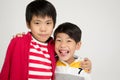 Two happy asian brothers hugging Royalty Free Stock Photo