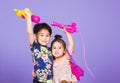 Two Happy Asian little boy and girl holding plastic water gun Royalty Free Stock Photo