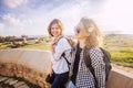 two happy attractive young girls traveling together, summer holiday and vacation, joy and communication, Friendship Day Royalty Free Stock Photo