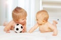 Babies boy and small girl play with football ball Royalty Free Stock Photo