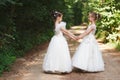 Happy beautiful girls with white wedding dresses