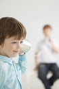 Two happy boy play in tin can phone Royalty Free Stock Photo