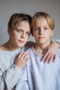 Two happy boys,brothers who are smiling together. twins und best friends. stay near each other, hug teenagers Royalty Free Stock Photo