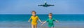 Two happy boys have fun on the beach watching the landing planes. Traveling on an airplane with kids concept. Text space Royalty Free Stock Photo