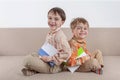 Two happy boys laughing. Everyone holds their book Royalty Free Stock Photo