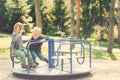 Two happy boys playing on playground in a park. Toned. Royalty Free Stock Photo