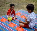 Two happy boys in society park, happy Asian brothers who are smiling happily together. Brothers play outdoors in summer, best Royalty Free Stock Photo