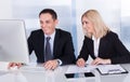 Two Happy Business Colleagues At Office Royalty Free Stock Photo