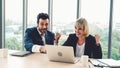 Two happy business people celebrate at office Royalty Free Stock Photo