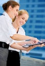 Two happy businesswomen with paper chart Royalty Free Stock Photo