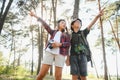 Two happy children having fun during forest hike on beautiful day in pine forest. Cute boy scout with binoculars during Royalty Free Stock Photo