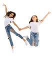 Two happy children jumping at once on a white background Royalty Free Stock Photo