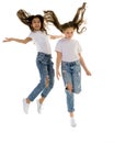 Two happy children jumping at once on a white background Royalty Free Stock Photo