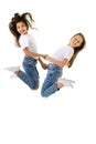 Two happy children jumping at once on a white background Royalty Free Stock Photo