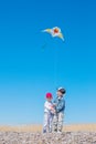 Two happy children with a kite