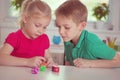 Two happy children playing with dices Royalty Free Stock Photo