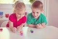 Two happy children playing with dices Royalty Free Stock Photo