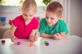 Two happy children playing with dices Royalty Free Stock Photo
