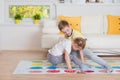 Two happy children playing exciting game at home Royalty Free Stock Photo