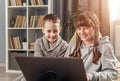 Two happy children using laptop Royalty Free Stock Photo