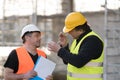 Two male civil engineers at work