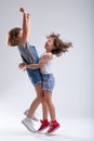 Two happy little girls hugging and jumping Royalty Free Stock Photo