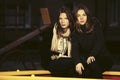 Two happy fashion teen girls on playground in the night Royalty Free Stock Photo