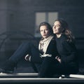 Two happy fashion teen girls on playground in twilight Royalty Free Stock Photo