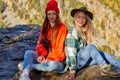 Two happy female travellers enjoy in nature
