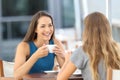 Two happy friends having a casual conversation Royalty Free Stock Photo