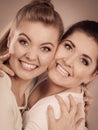 Two happy friends women hugging Royalty Free Stock Photo