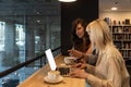 Two happy gen Z student girls watching webinar, attending online class, learning conference, talking to teacher on video call, Royalty Free Stock Photo